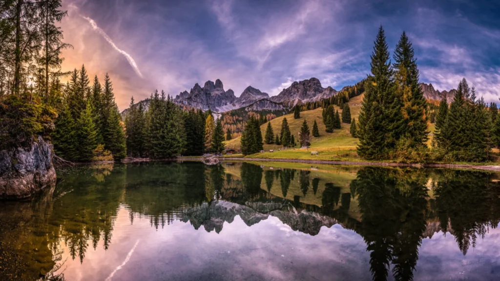 Autumn in Filzmoos: Golden and crimson tones adorning the enchanting Alpine scenery reflect in calm ponds, offering unparalleled peace.